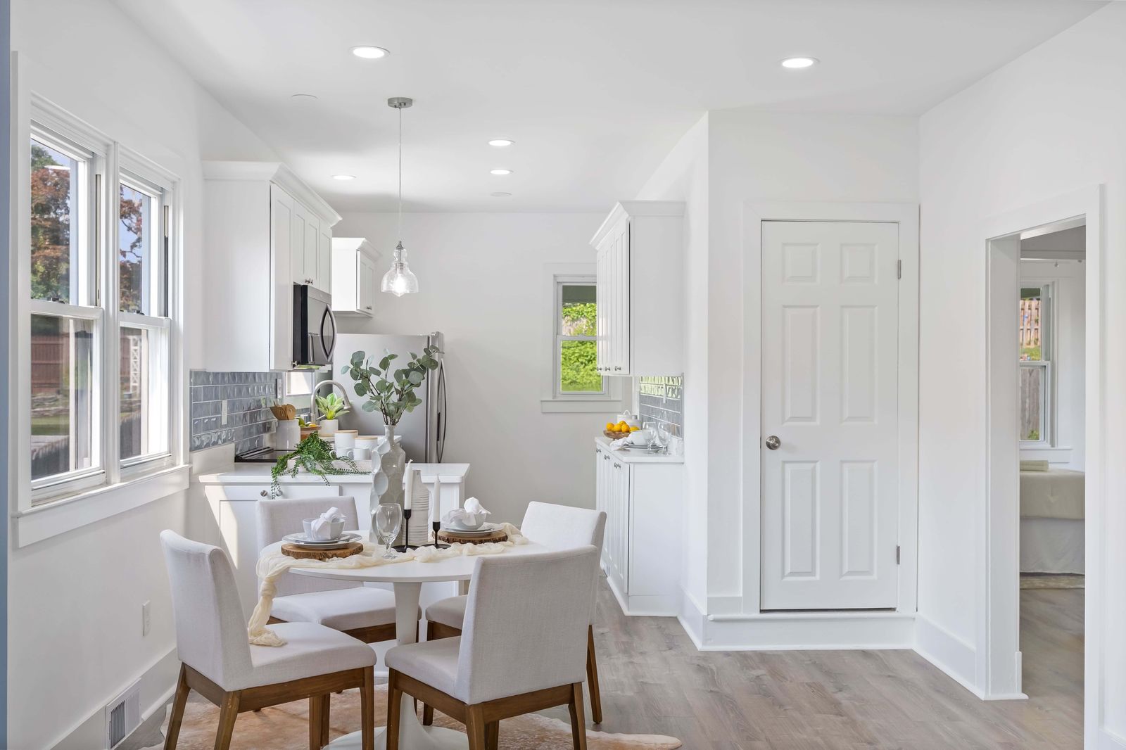 Bright modern kitchen with round dining table